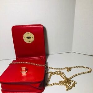 Red evening bag. Long gold strap NWOT